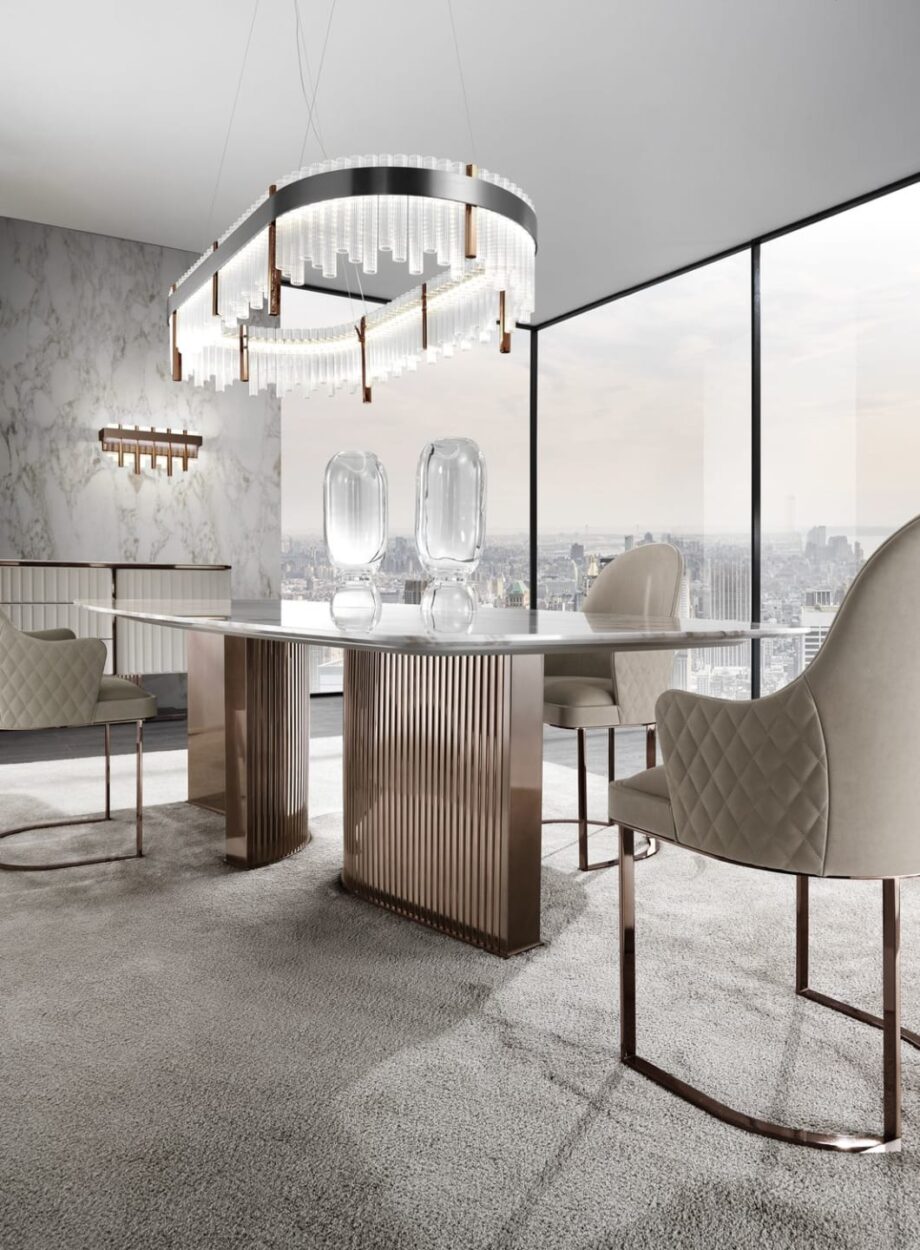 Tiffany table | DV home. Exquisite dining table featuring a luxurious marble top and a distinctive curved stainless steel base, embodying Art Deco elegance.
