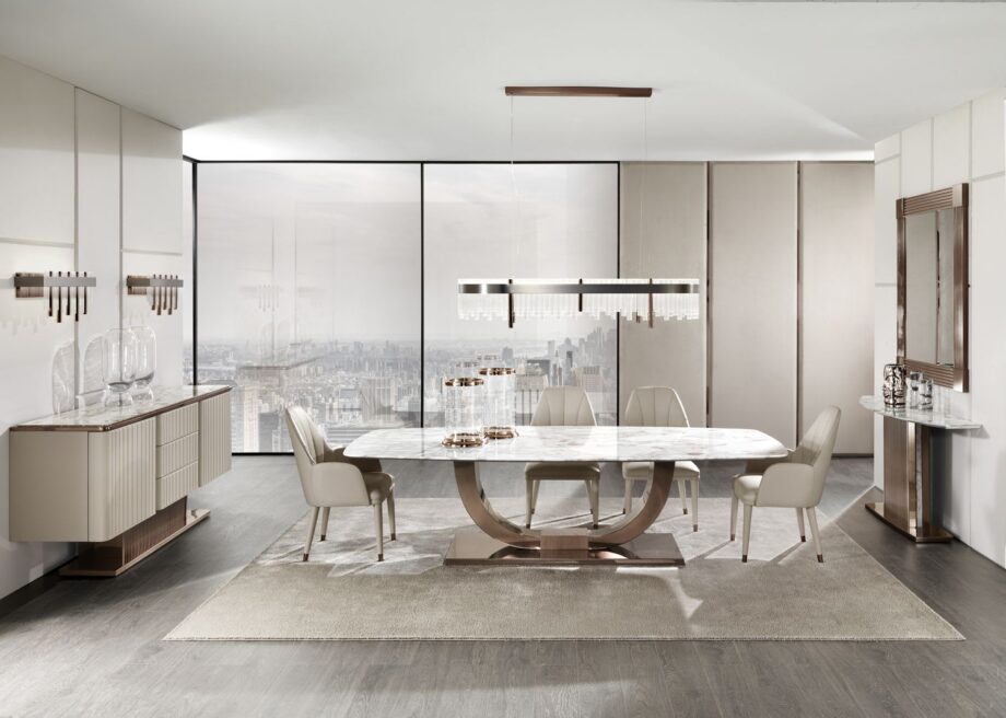 Heritage table | DV home. Luxurious dining table with bold Art Deco design, stainless steel base, and exquisite top options.