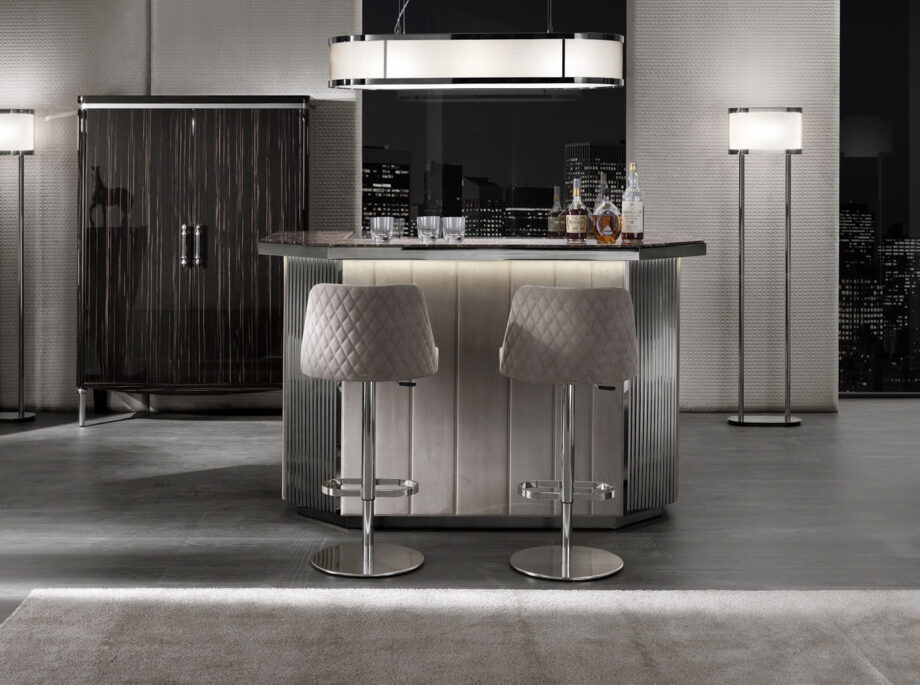Byron bar chair | DV home. Adjustable height stool with a solid wood structure and stainless steel base, featuring a luxurious quilted back.