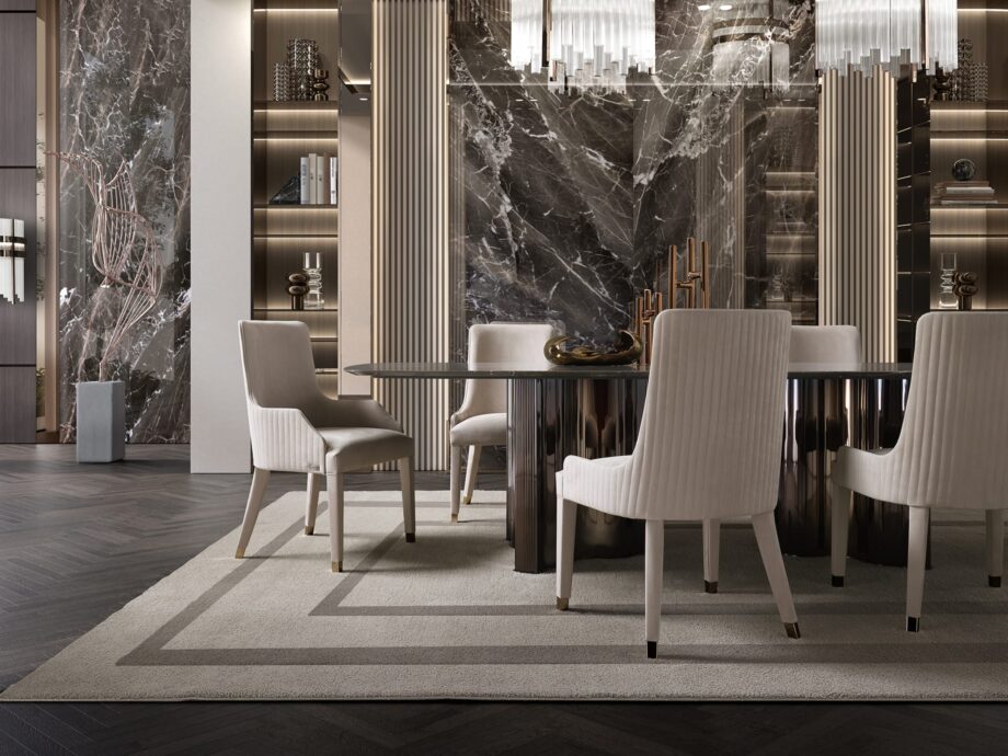 Byron Cannetè chair | DV home. Elegant armchair with a distinctive cannetè back and polished steel feet, offering luxurious comfort.
