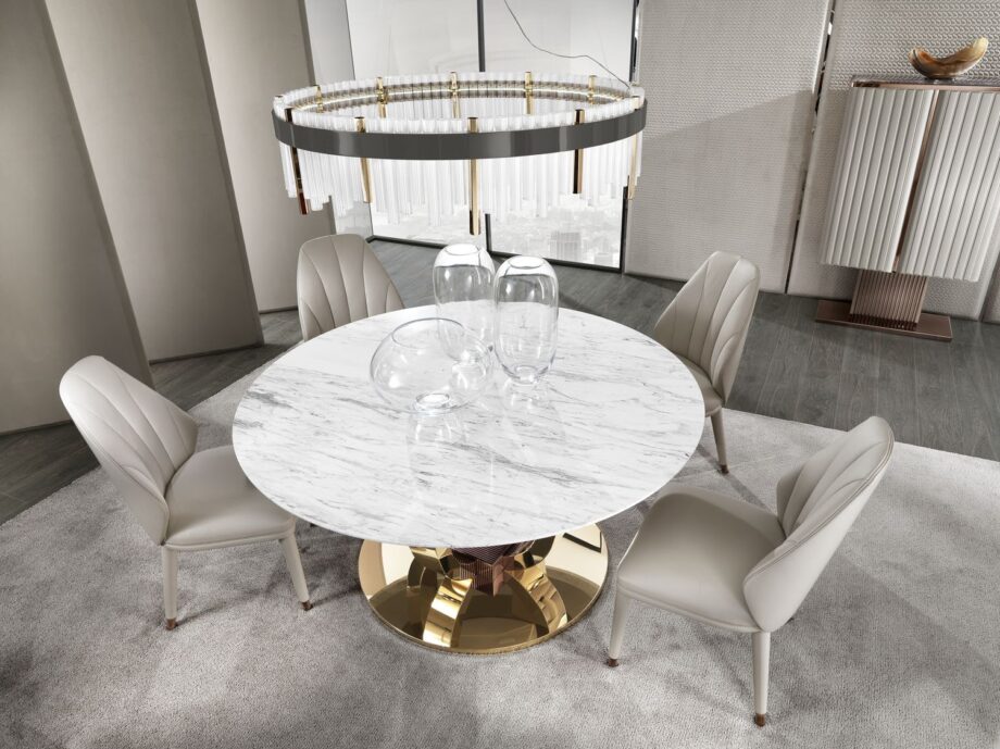 Hermes Round table | DV home. Exquisite Art Deco dining table with a luxurious marble top and a distinctive metal base, perfect for upscale interiors.
