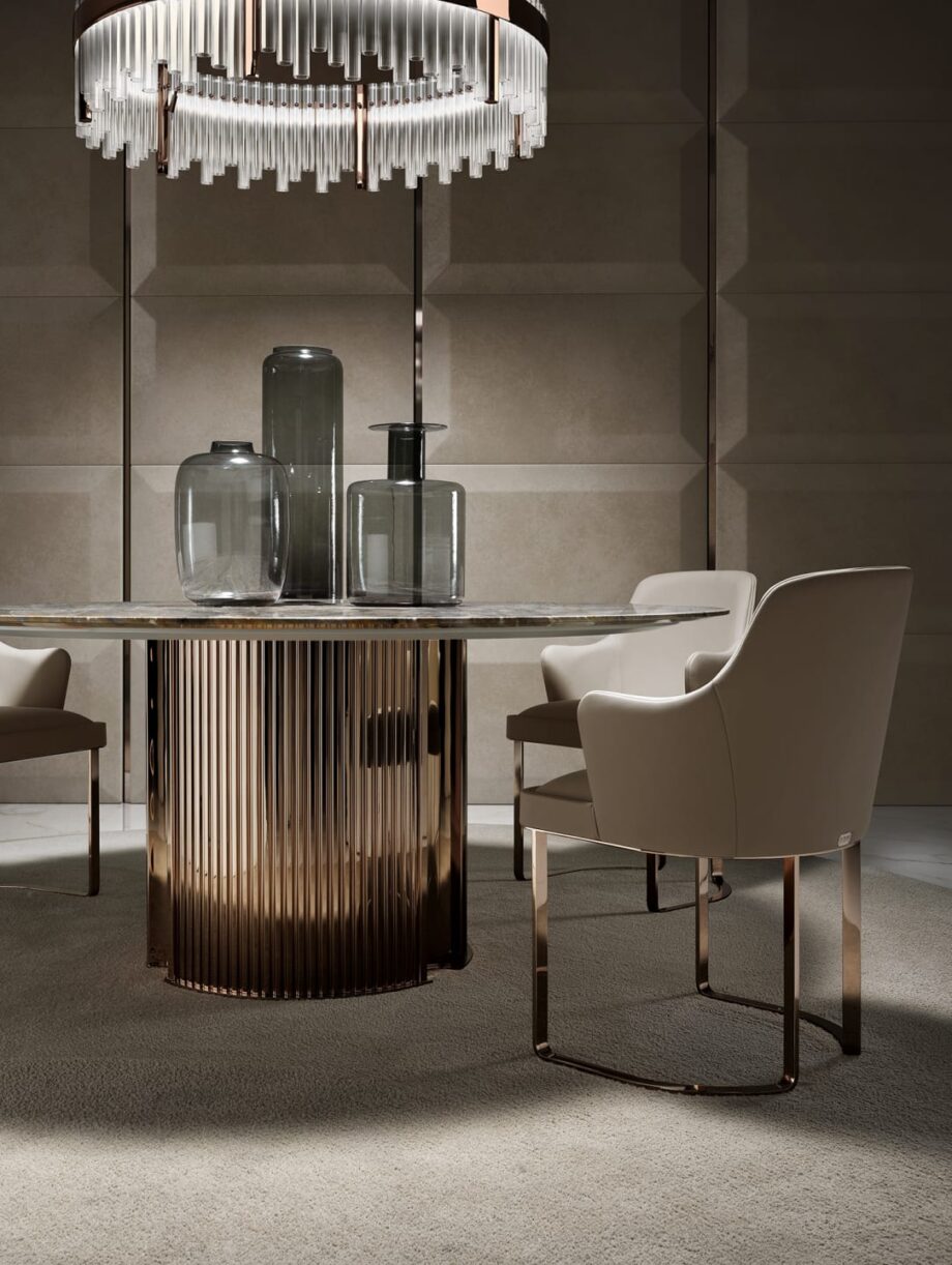 Ritz Low chair | DV home. Designer armchair with soft quilted armrests and a shining chrome base.