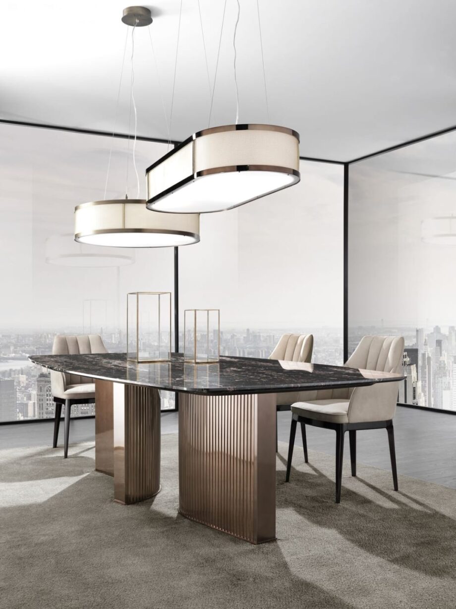 Tiffany table | DV home. Exquisite dining table featuring a luxurious marble top and a distinctive curved stainless steel base, embodying Art Deco elegance.