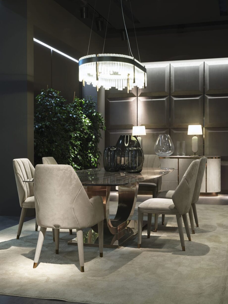 Heritage table | DV home. Luxurious dining table with bold Art Deco design, stainless steel base, and exquisite top options.