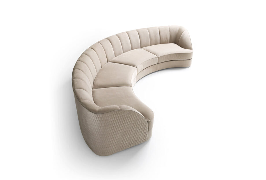 Charlotte Moon sofa | DV home. Exquisite curved Art Deco sofa with luxurious upholstery, emphasizing status and taste.