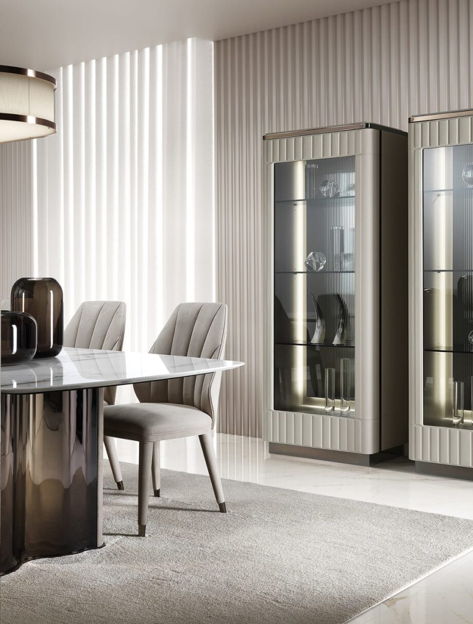 Elite chair | DV home. Luxurious Italian armchair with elegant curves, premium upholstery, and polished steel details, perfect for sophisticated interiors.