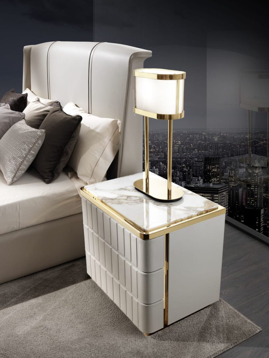 Elite bedside table | DV home. Art Deco bedside table with leather finish and marble top, offering elegance and functionality.