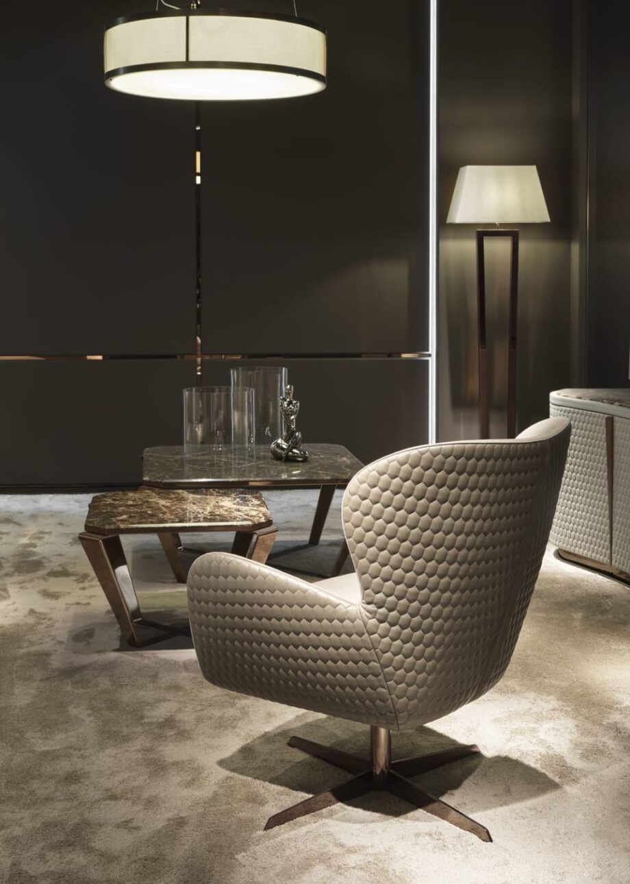 Elite armchair | DV home. Elegant swivel armchair with a chrome base, offering luxurious comfort and contemporary style.
