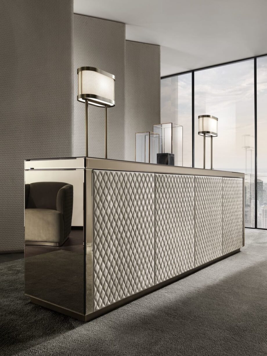 Envy sideboard | DV home. Elegant sideboard featuring geometric mirrored or luxurious leather pattern, internal drawers, and a polished stainless steel base.