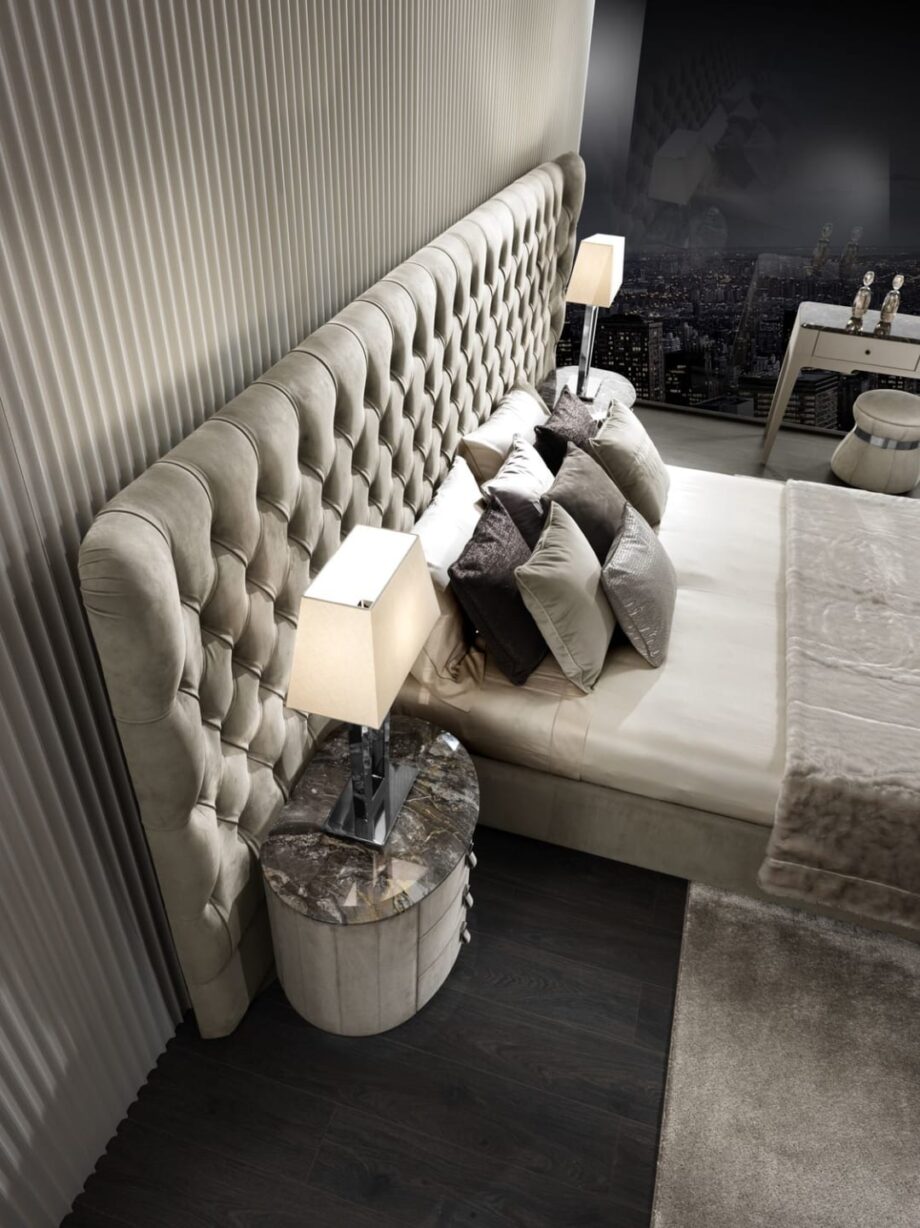 Vogue Maxi bed | DV home. Luxurious bed with a high, tufted headboard, offering unparalleled comfort and a grand, elegant presence.