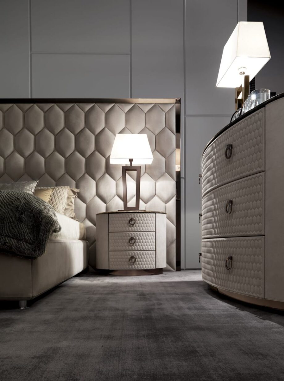 Charlotte bedside table | DV home. Handcrafted luxury night table with hexagon-patterned drawers, premium leather or walnut finishes, and a polished stainless steel base.