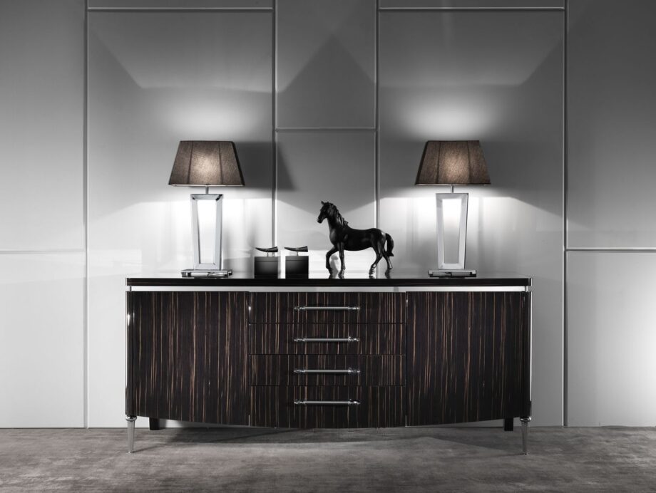 Ritz table lamp | DV home. Elegant Art Deco table lamp with a striking metal base and luxurious fabric shade, perfect for sophisticated interiors.