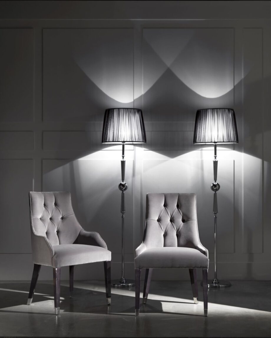 Byron Capitonné chair | DV home. Exquisite armchair featuring capitonné upholstery and polished steel feet, perfect for elegant interiors.