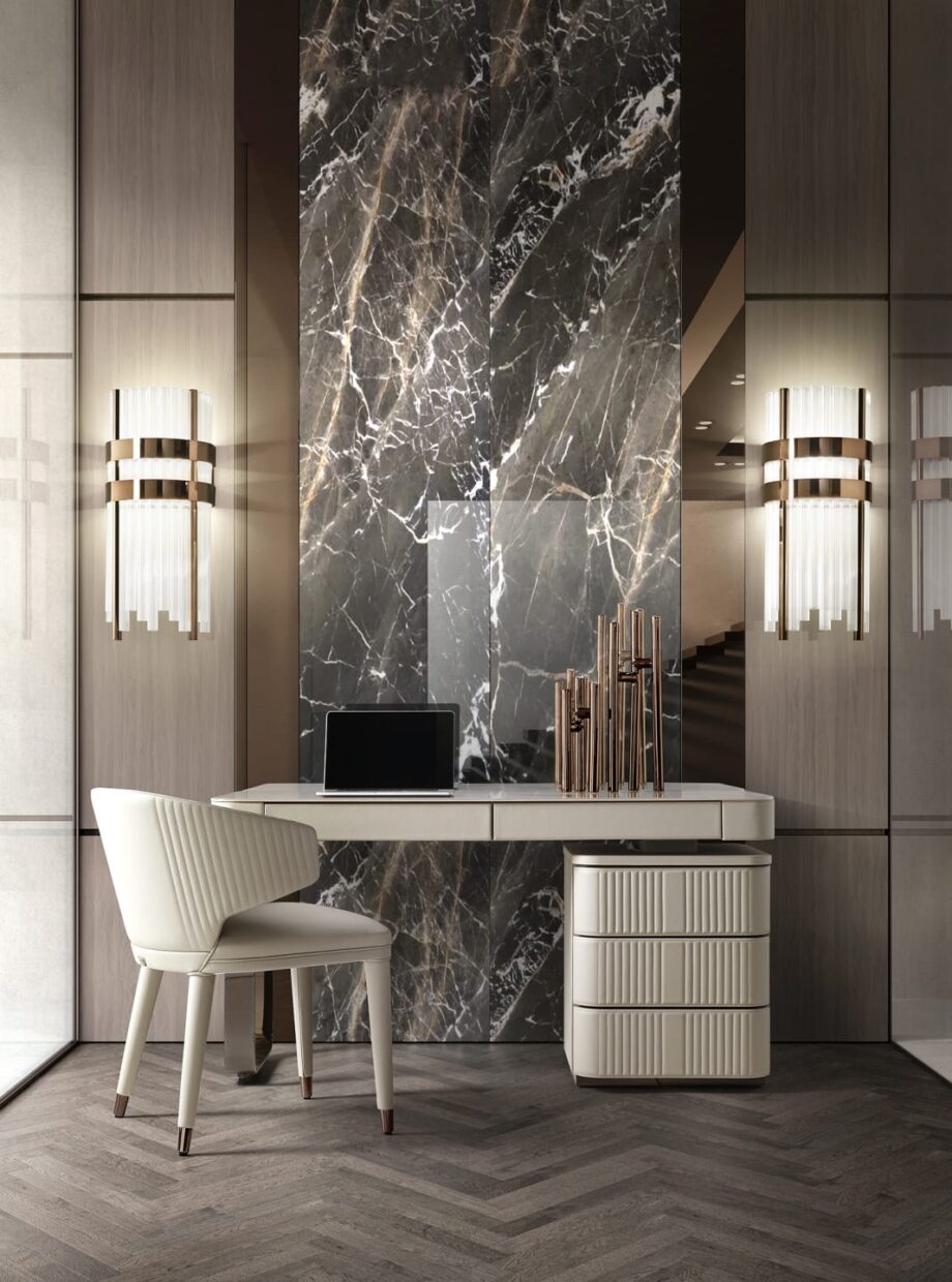 Elite Round wall lamp | DV home. Elegant Art Deco wall lamp with metal frame and fluted transparent glass cylinders, offering luxurious illumination.