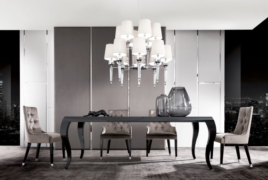 Byron Capitonné chair | DV home. Exquisite armchair featuring capitonné upholstery and polished steel feet, perfect for elegant interiors.