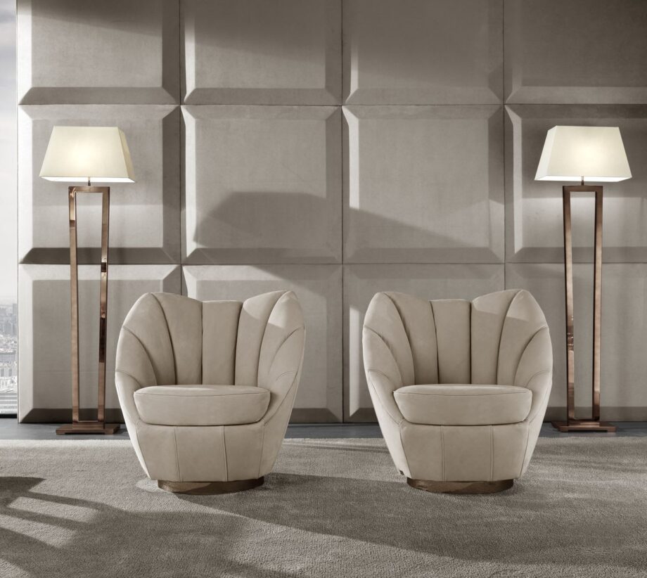 Royal armchair | DV home. Elegant swivel armchair with premium upholstery and a polished stainless steel base.