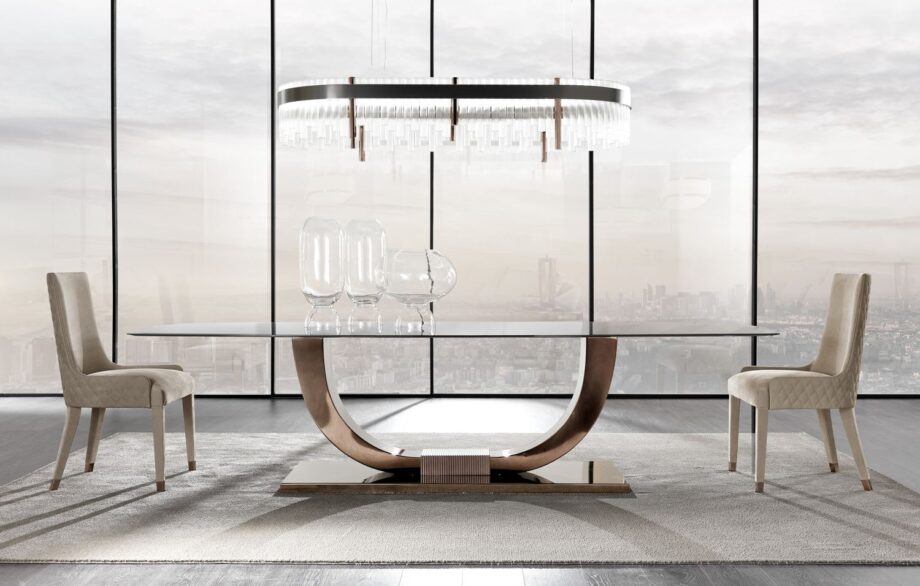 Heritage table | DV home. Luxurious dining table with bold Art Deco design, stainless steel base, and exquisite top options.