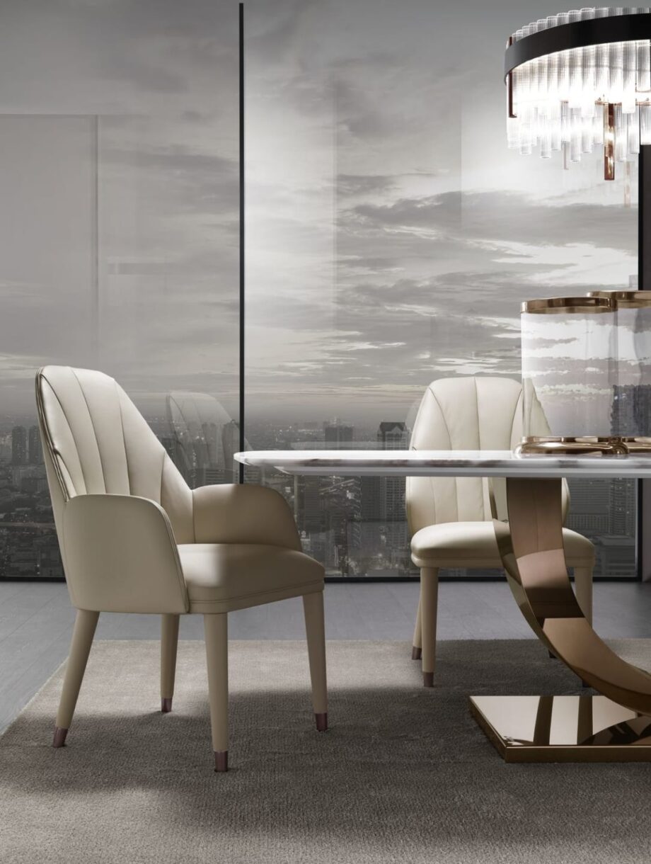 Elite chair | DV home. Luxurious Italian armchair with elegant curves, premium upholstery, and polished steel details, perfect for sophisticated interiors.