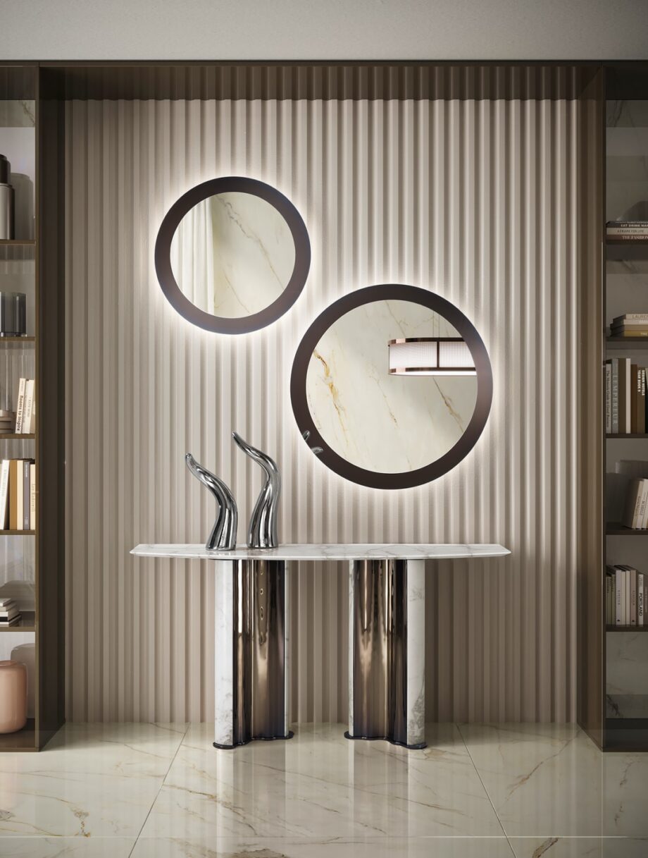 Envy Circle mirror | DV home. A luxurious round mirror with a polished stainless steel frame, perfect for adding an elegant Art Deco touch to any sophisticated interior.