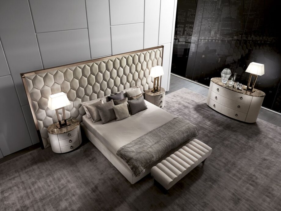 Envy Maxi bed | DV home. Luxurious bed with geometric upholstered high headboard and elegant metallic frame, perfect for high-end interiors.
