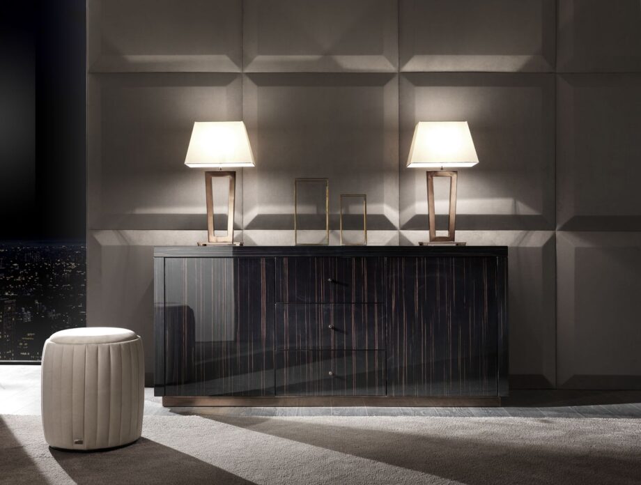 Ritz table lamp | DV home. Elegant Art Deco table lamp with a striking metal base and luxurious fabric shade, perfect for sophisticated interiors.