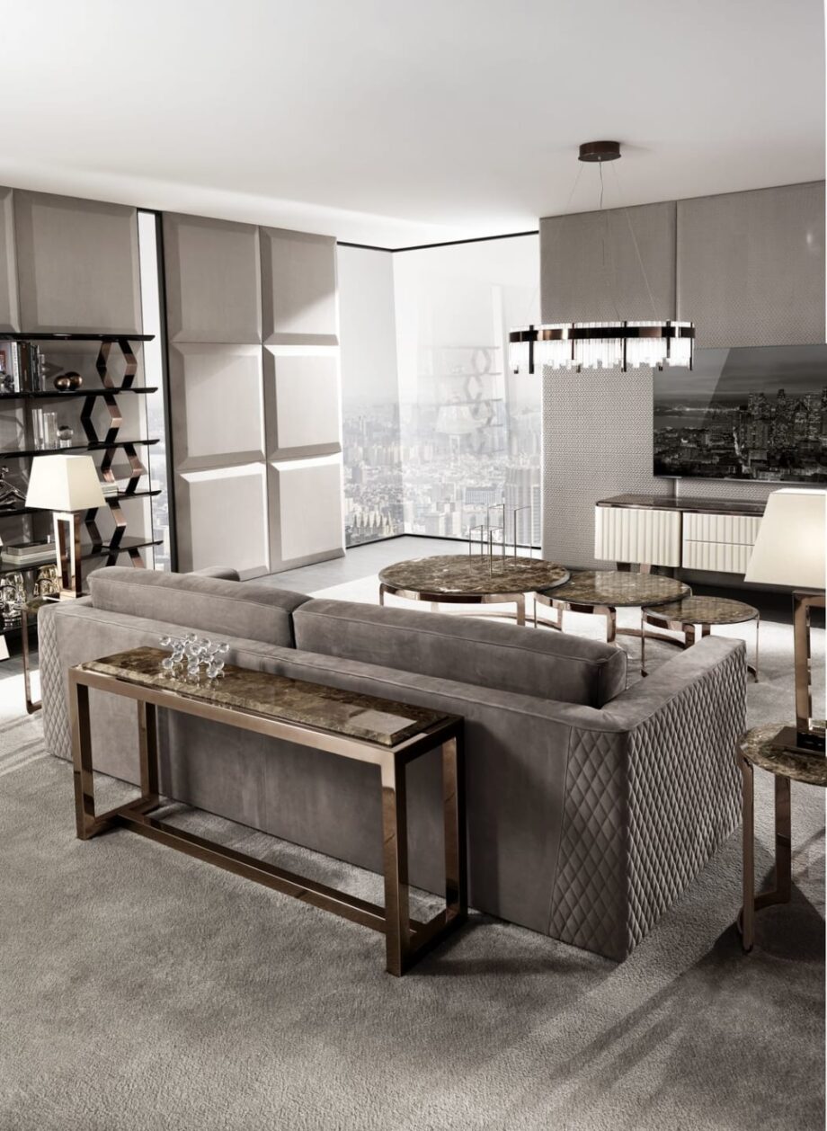 Age console | DV home. Luxurious console with a sleek stainless steel base and an elegant marble top, embodying timeless design.