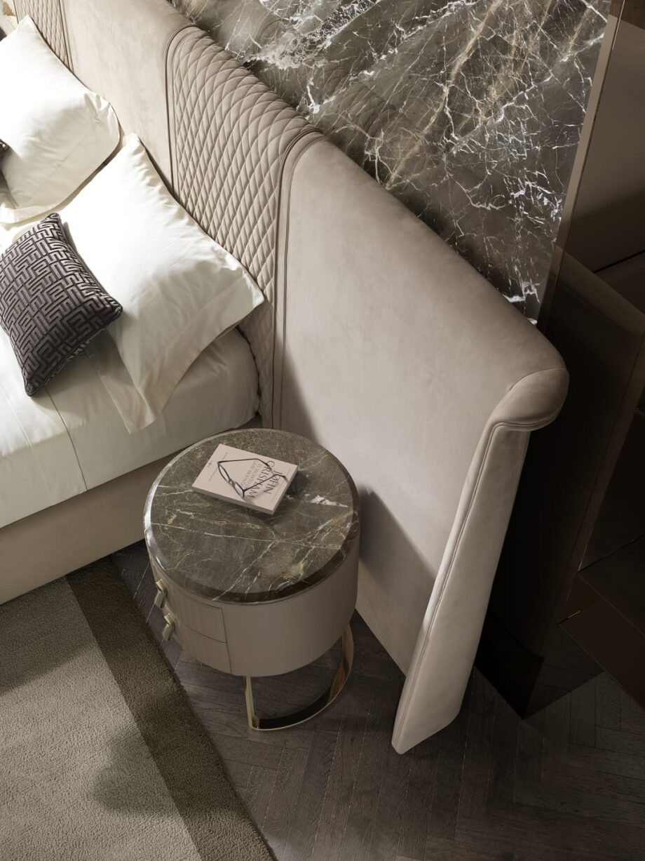 Soho bedside table | DV home. Luxurious Art Deco bedside table with a round leather top and elegant antique bronze steel base.