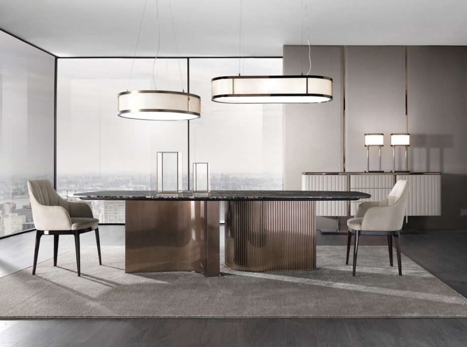 Tiffany table | DV home. Exquisite dining table featuring a luxurious marble top and a distinctive curved stainless steel base, embodying Art Deco elegance.