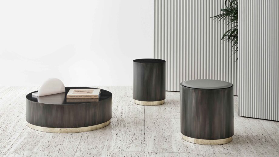 Genesi coffee table | Rugiano. Flamed iron with glossy gold details, convertible into a comfortable seat with a cushion.