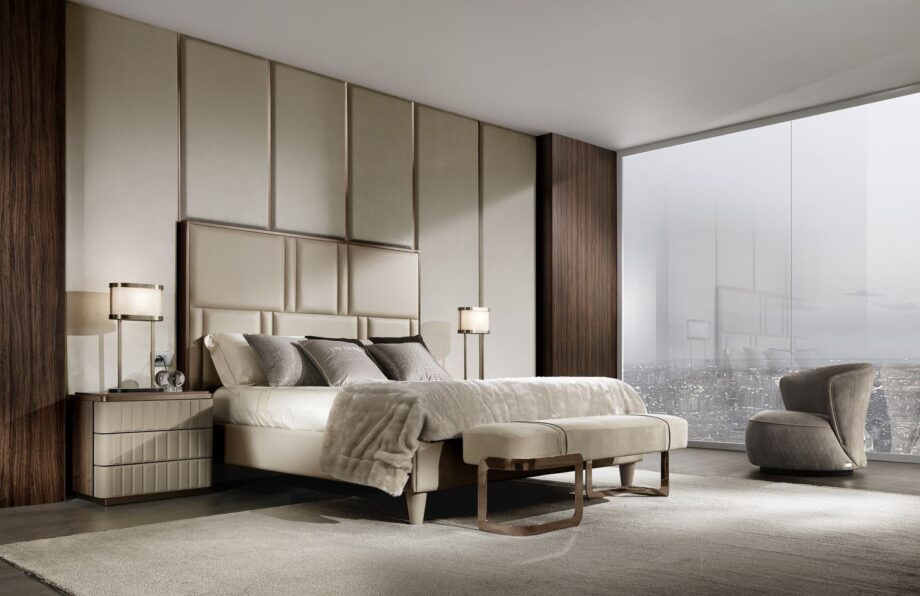 Elite bed | DV home. Elegant bed featuring a high tufted headboard and sophisticated metallic accents, creating an ambiance of luxury and comfort.