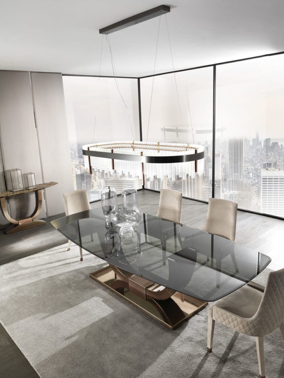 Heritage table | DV home. Luxurious dining table with bold Art Deco design, stainless steel base, and exquisite top options.