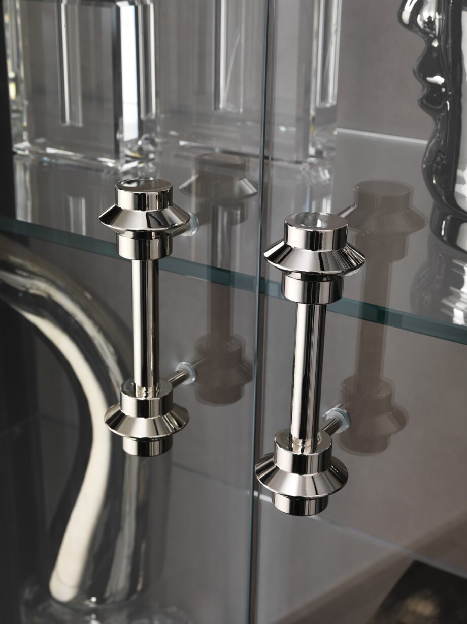Egoist display cabinet | DV home. Exquisite display case with integrated lighting, crafted from veneered wood and tempered glass, featuring elegant brass details.