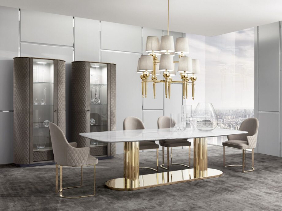 Douglas Suite table | DV home. Exquisite dining table featuring a luxurious marble top and opulent metallic base, perfect for creating a captivating focal point.