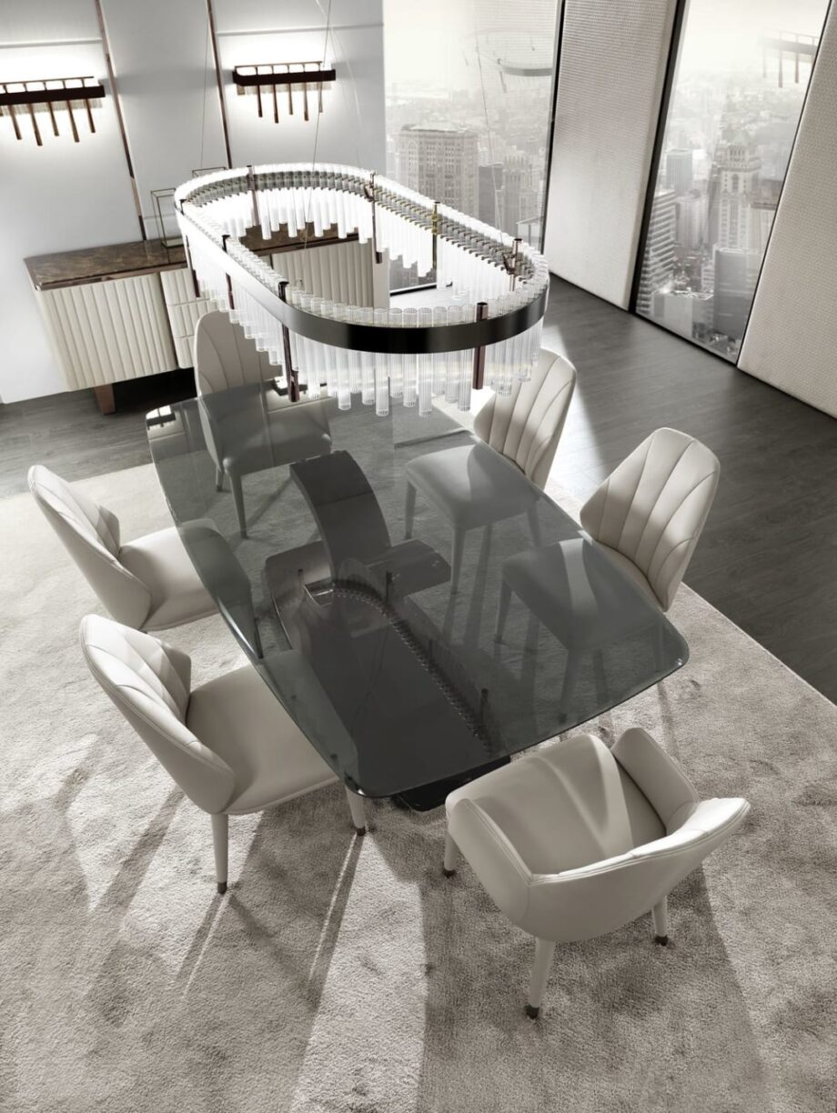 Elite chair | DV home. Luxurious Italian armchair with elegant curves, premium upholstery, and polished steel details, perfect for sophisticated interiors.