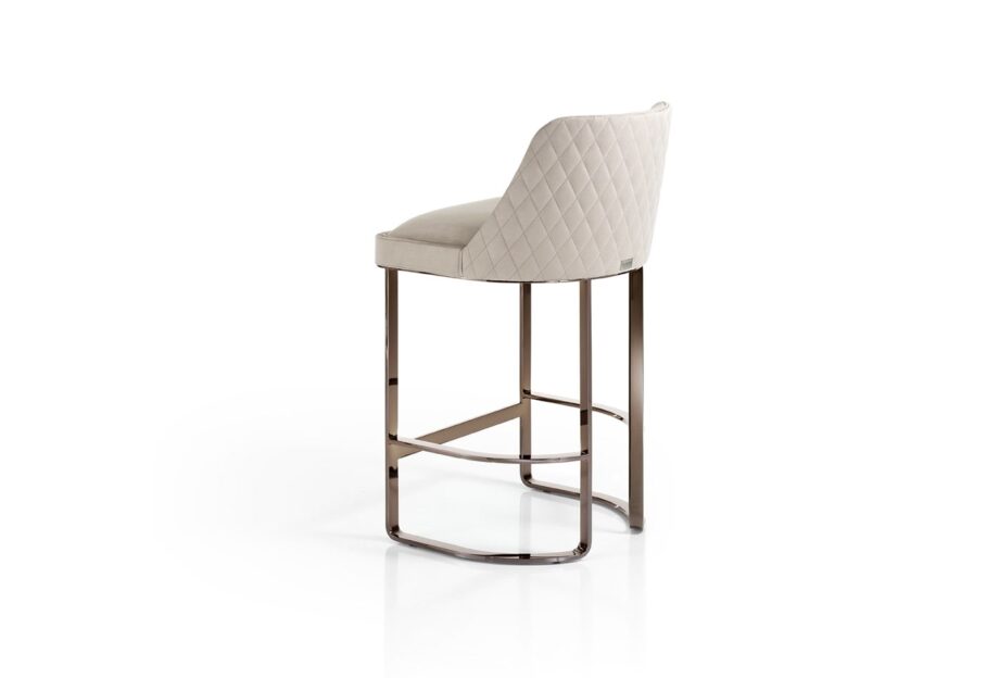 Ritz bar chair | DV home. Italian luxury stool with a quilted back and polished stainless steel base, embodying modern elegance.