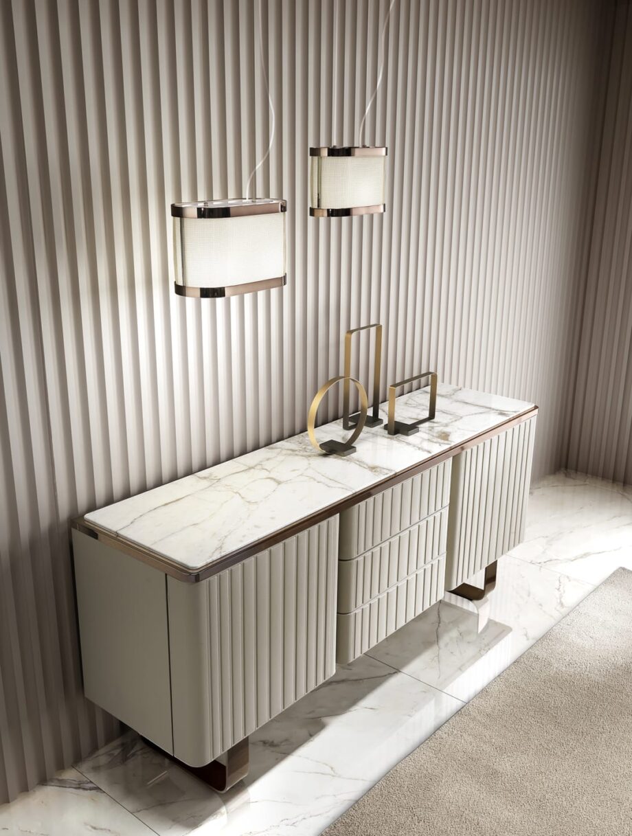 Elite sideboard | DV home. Luxurious Art Deco and Contemporary buffet with fluted design, premium leather/lacquer finishes, marble/walnut top, and stainless steel accents.