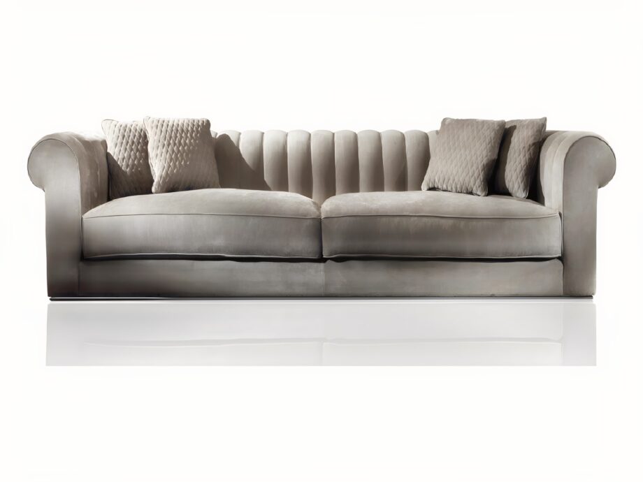 Kent sofa | DV home. Luxurious Italian sofa with goose feather cushions, chrome base, and custom sizing, offering unparalleled comfort and elegant design.