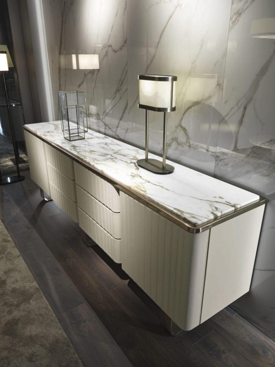 Elite sideboard | DV home. A luxurious Art Deco sideboard featuring exquisite leather or lacquered fronts, a marble or Canaletto walnut top, and polished steel details.
