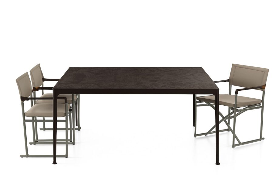 Mirto Outdoor outdoor table | B&B Italia. Innovative outdoor table with minimalist design, durable lava stone top, and eco-friendly recycled material. Stylish and versatile.