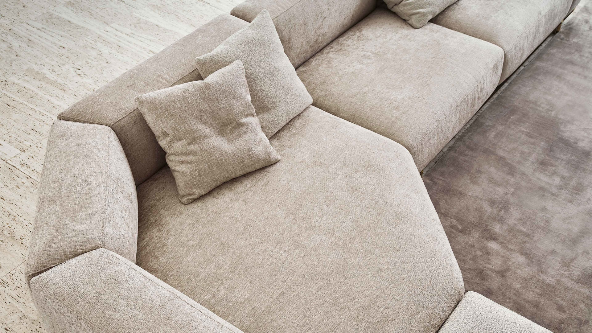 Boheme sofa | Rugiano. Luxurious leather sofa with metal base and elegant gold or bronze accents.