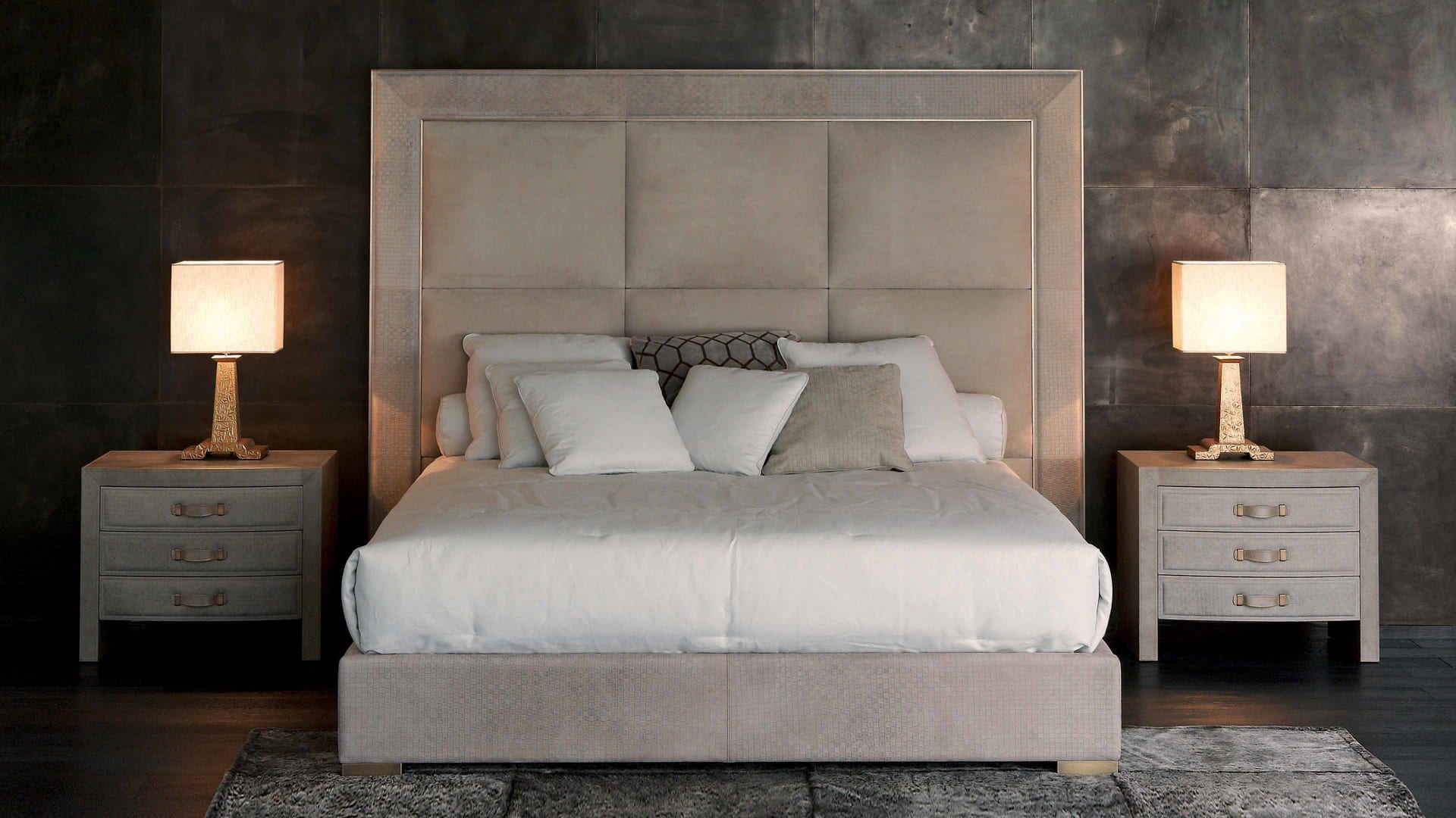 Aura bed | Rugiano. Luxurious bed with geometrically padded upholstered headboard and elegant metal details, designed for ultimate comfort.