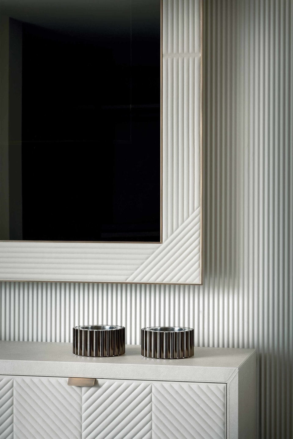 Ghost tv furniture | Rugiano. Upholstered TV cabinet with integrated media mirror and elegant metal detailing.