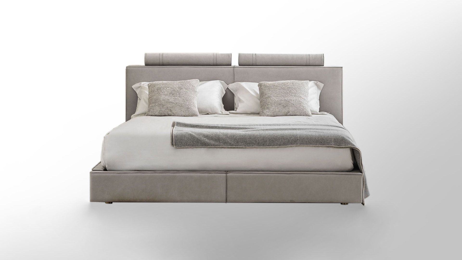 Rubik bed | Rugiano. A contemporary luxury bed with a distinctive upholstered headboard, offering supreme comfort and sophisticated style for modern bedrooms.
