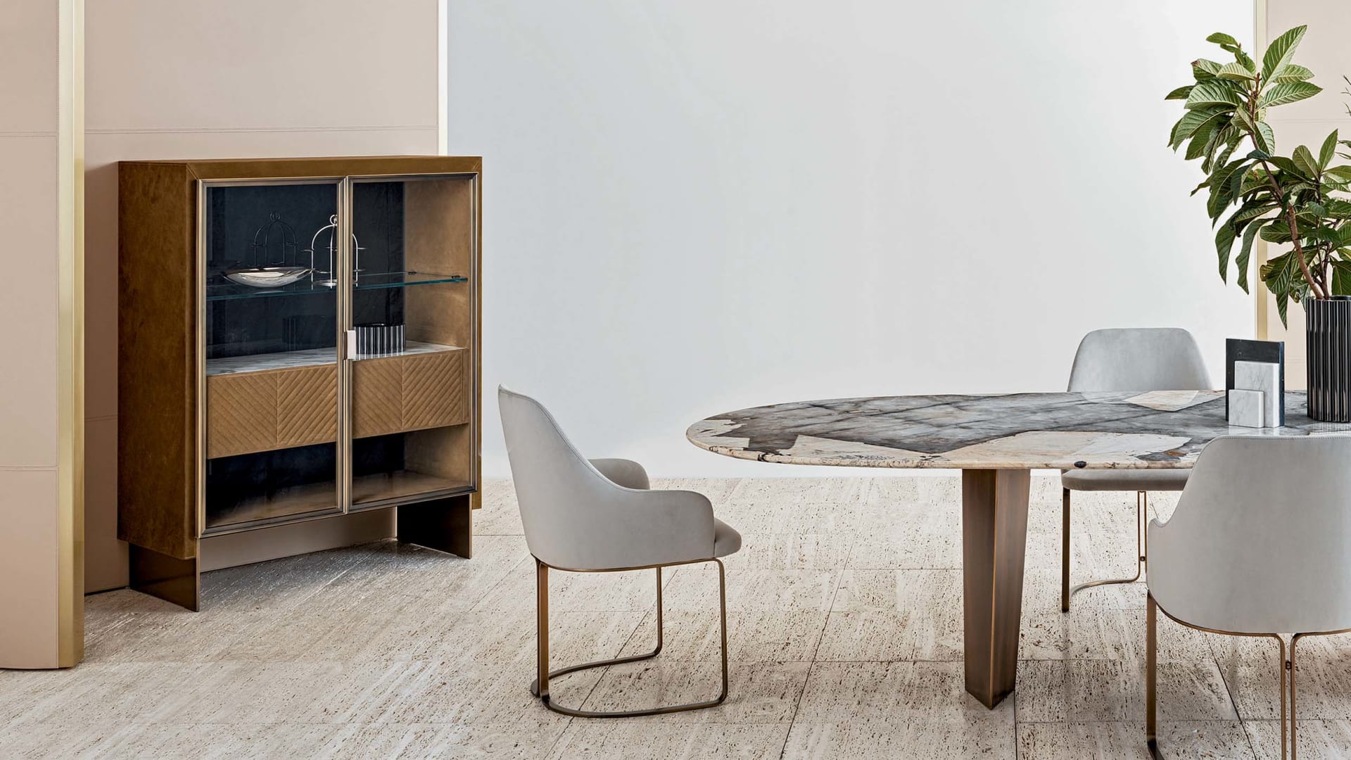 Iole sideboard | Rugiano. Luxurious sideboard with leather upholstery, bronze details, marble top with backlighting, and elegant glass doors.