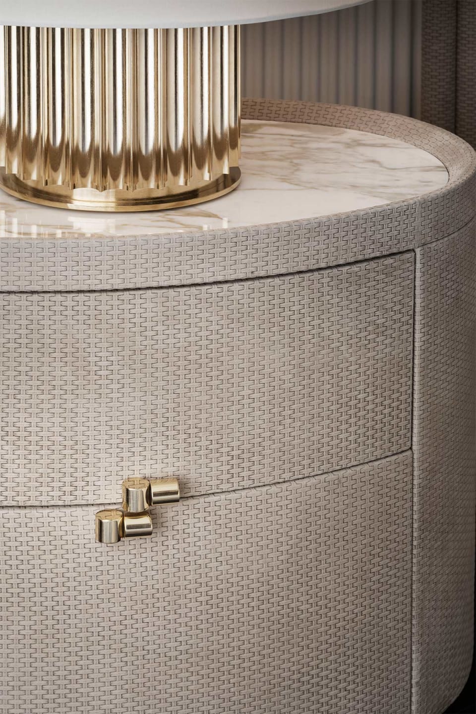 Boheme bedside table | Rugiano. Exquisite bedside table featuring leather upholstery, a marble top, and glossy brass accents, equipped with two drawers.