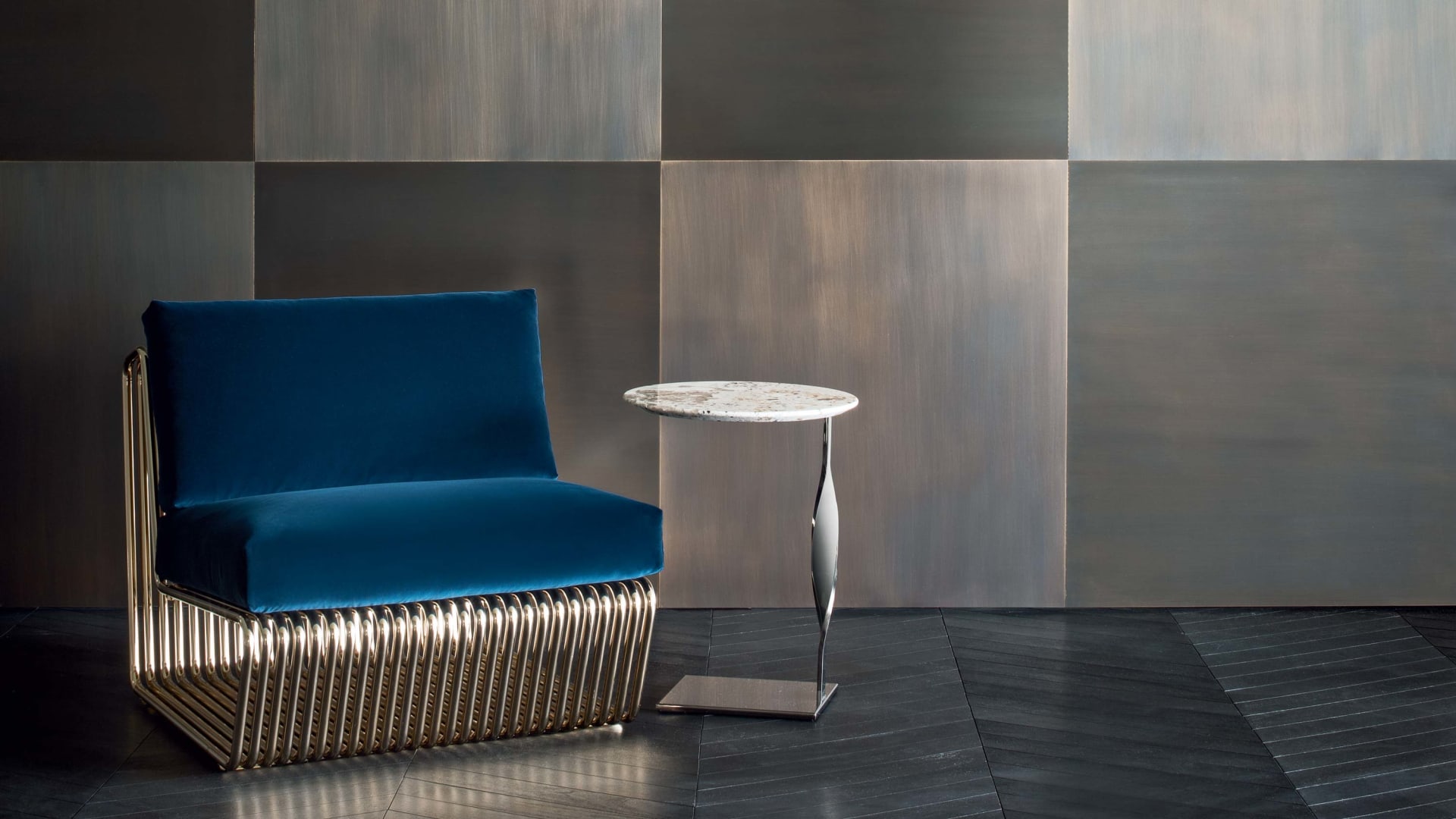 Infinity armchair | Rugiano. A sculptural piece with a sinuous shape and luxurious metal accents, offering unparalleled style and comfort.