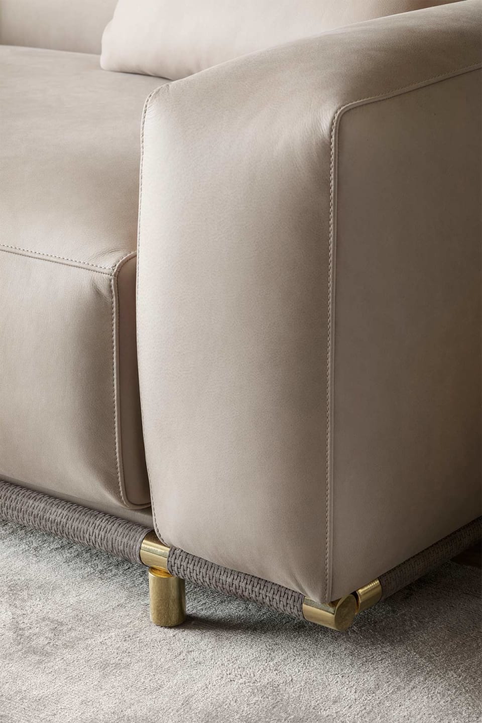 Boheme sofa | Rugiano. Luxurious leather sofa with metal base and elegant gold or bronze accents.