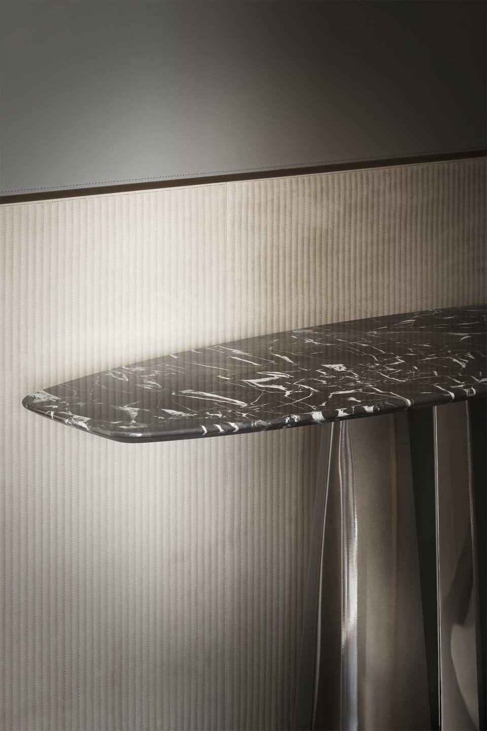 Absolute console | Rugiano. Elegant console with a striking sculptural metal base and a versatile top in various luxurious finishes.