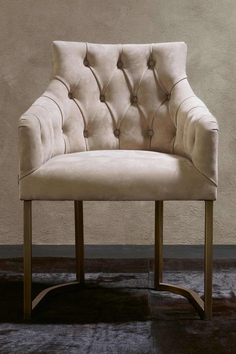 Itaca armchair | Rugiano. Luxuriously upholstered chair with elegant metal legs, offering refined comfort and bespoke finishes for any sophisticated interior.