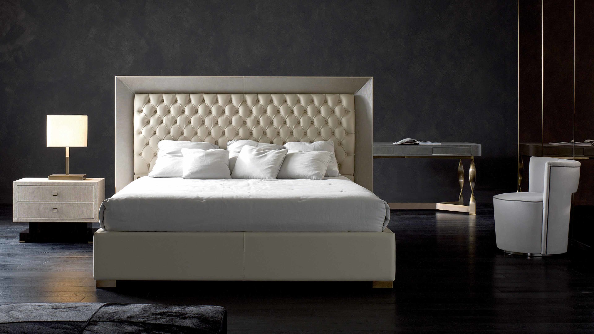 Kenya bed | Rugiano. An elegant bed featuring a distinctive tufted headboard, available with an upholstered or Makassar Ebony frame.